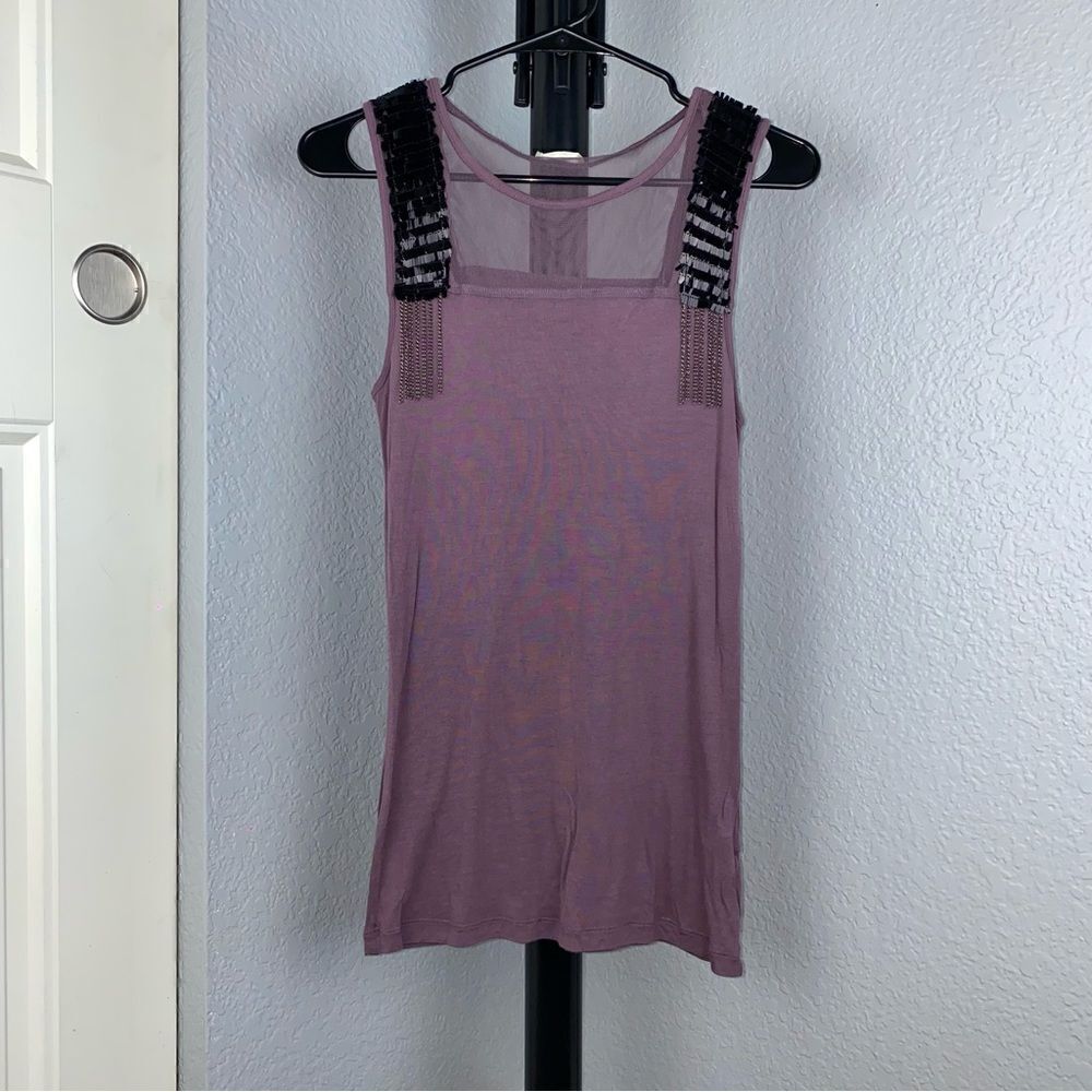 Calliope size small women’s tank top with edgy details.